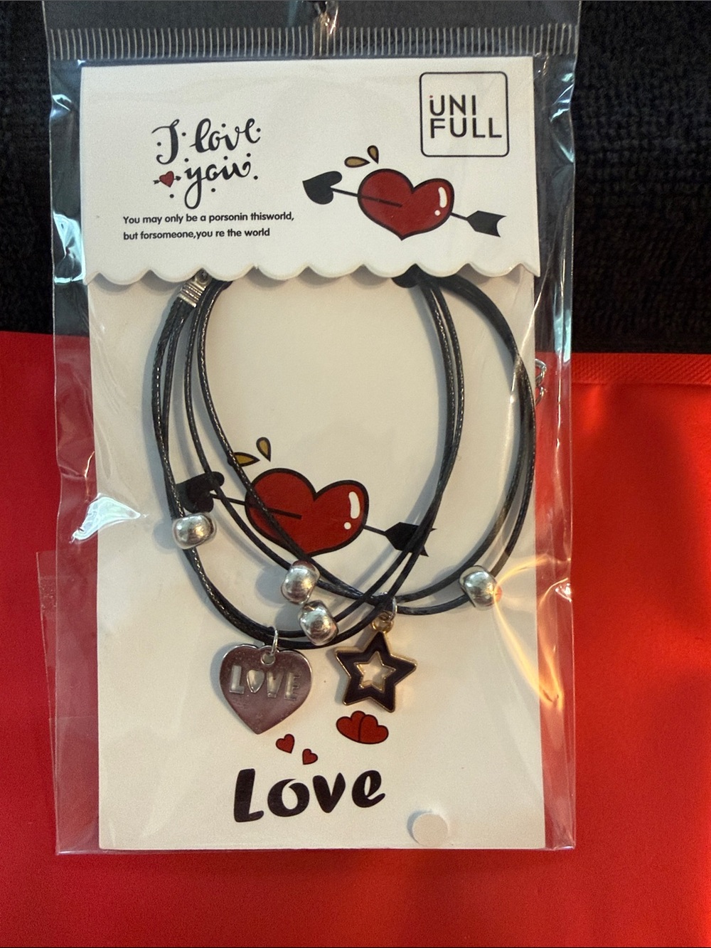 Love black cord charm bracelet set with silver beads and heart and star charms